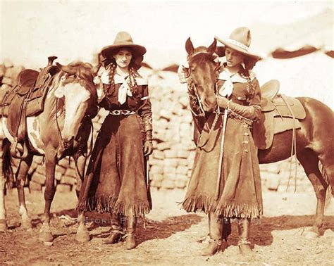 Two cowgirls and their horses in the 1912 Buffalo Bill Wild West.